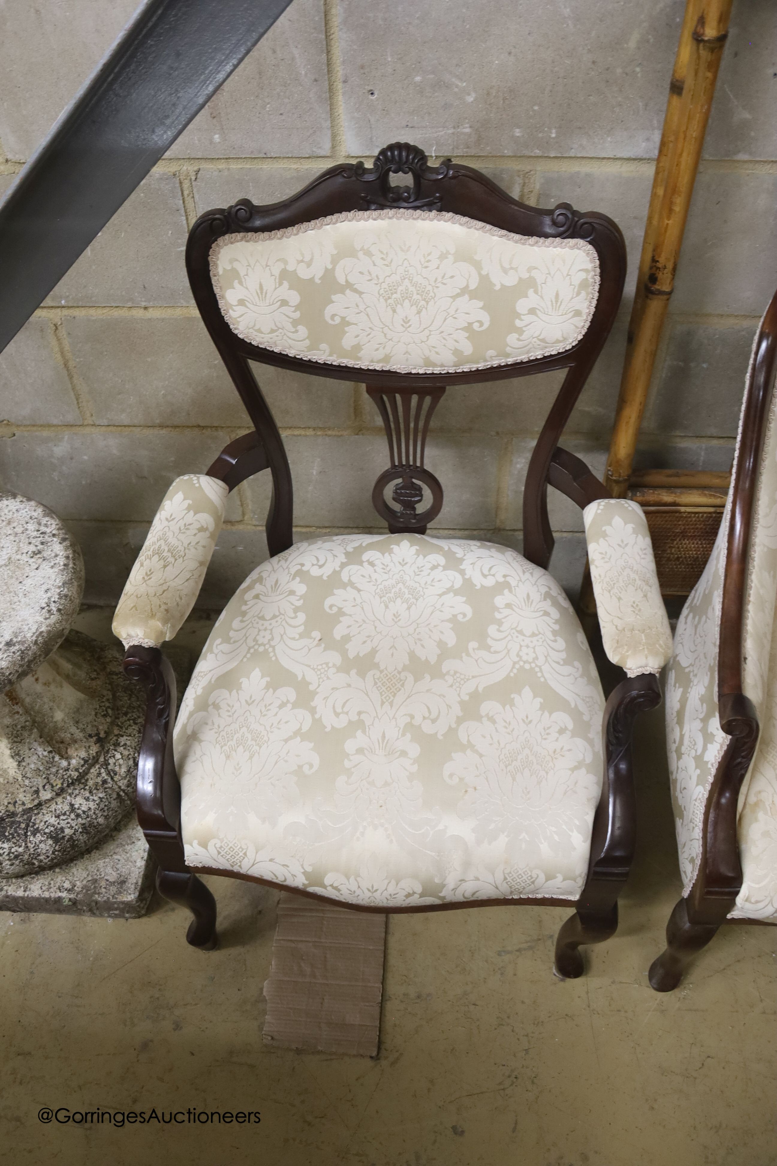 A late Victorian mahogany three piece salon suite
